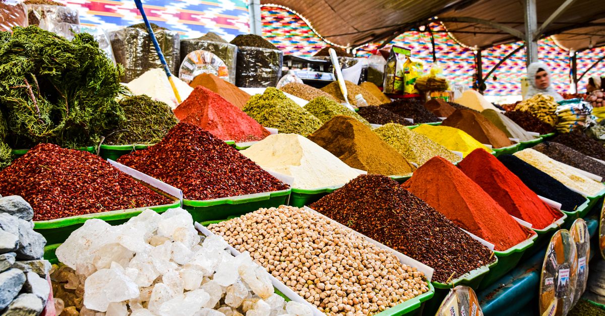 Vibrant display of spices at bazaar market, showcasing variety and color.
